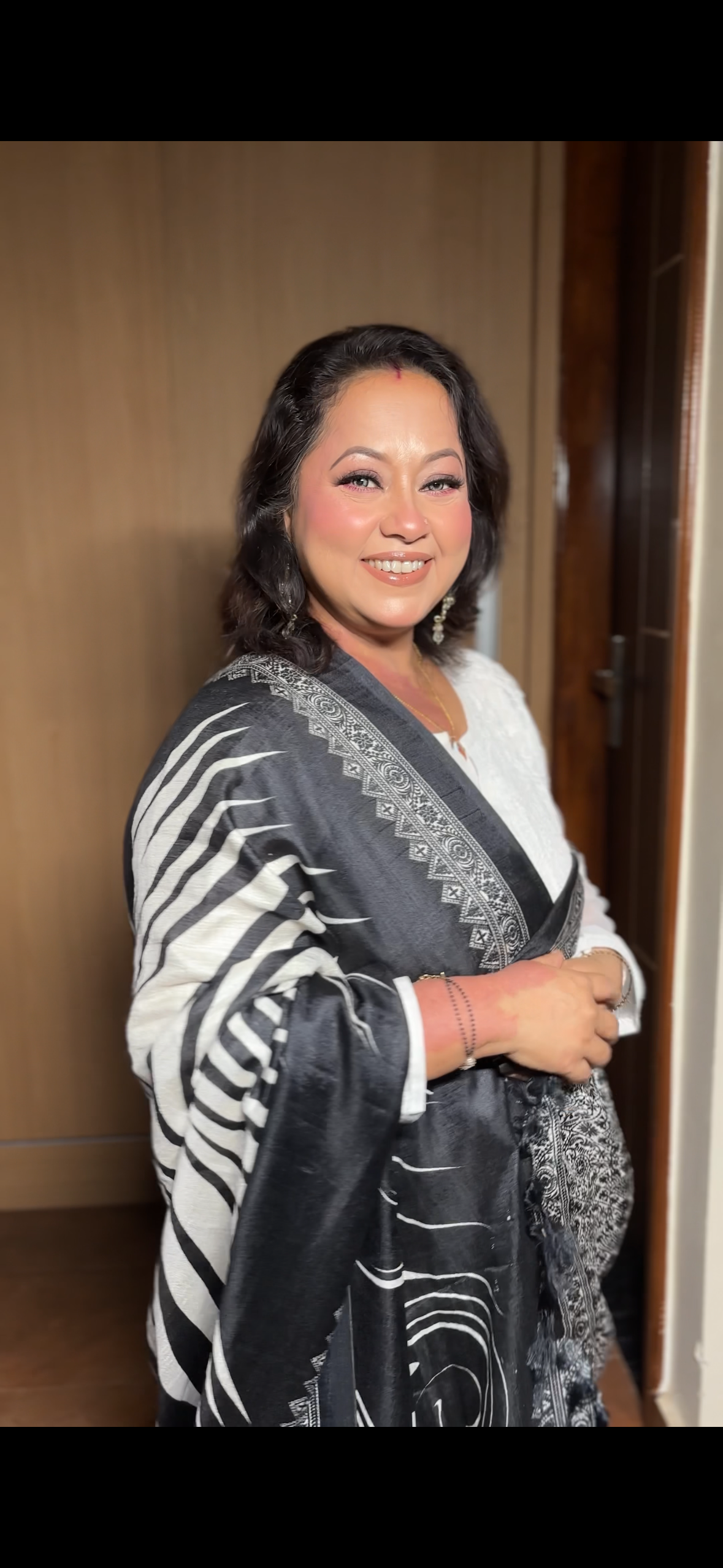 Elegant lady in festive silk saree with refined makeup and open hair